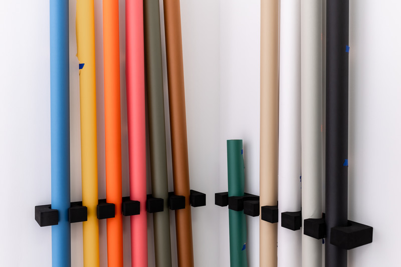 Seamless paper backdrop rolls in the studio.